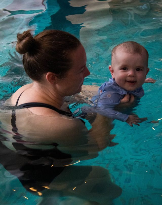 A family relaxing together in the private heated pool at The Willows Spa